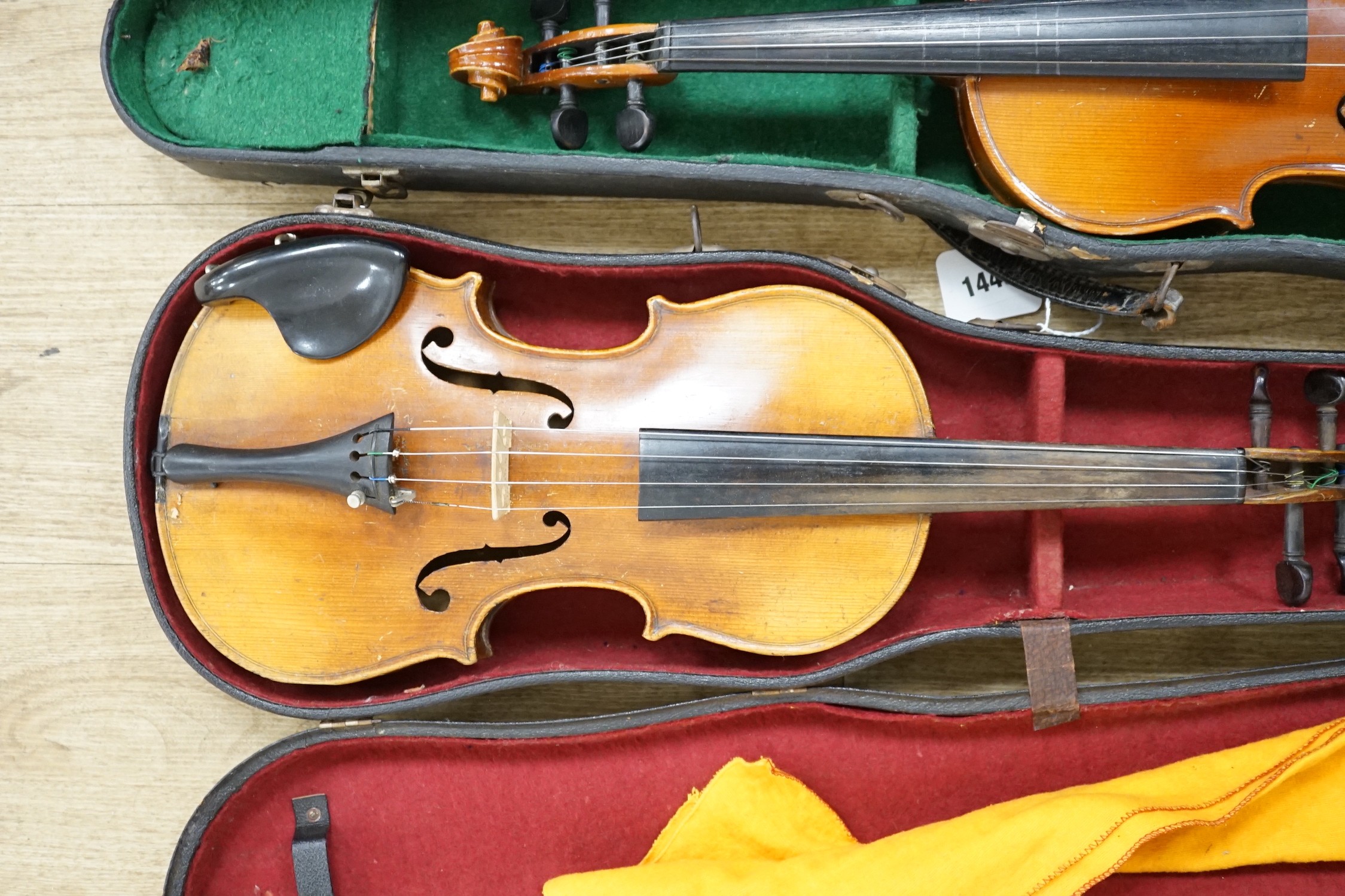 Two cased double back violins